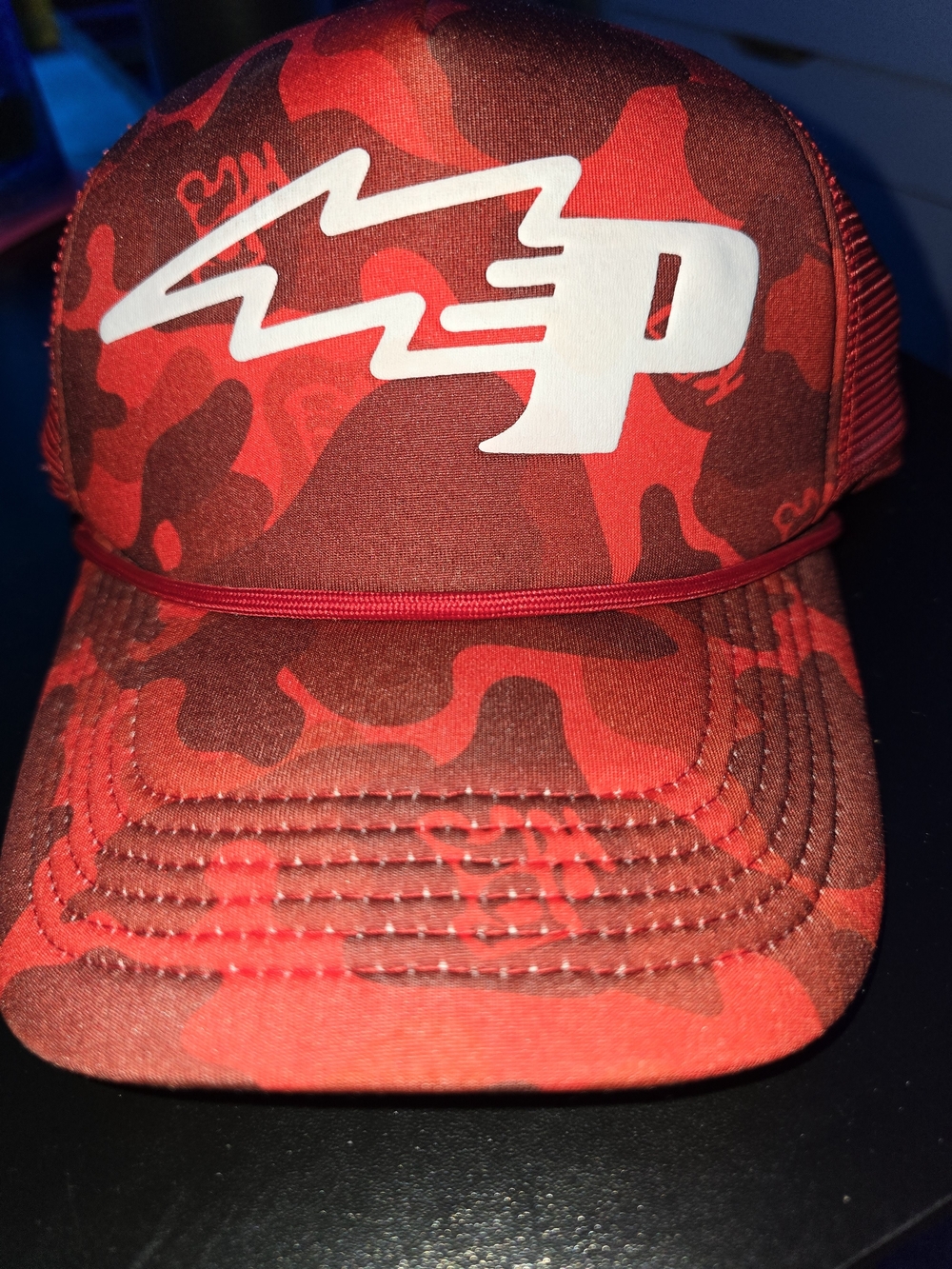 Bass Resources P-Star Cap in red camo featuring a distinctive white embroidered